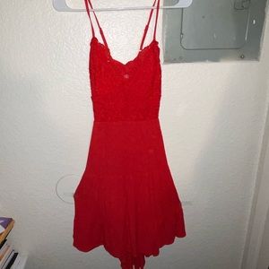 Spaghetti strapped and adjustable cute red dress! With a tie in the back!